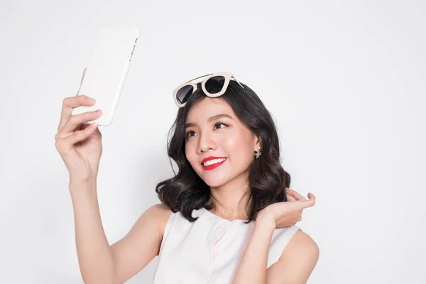 Fashionable girl taking selfie — Stock Photo, Image