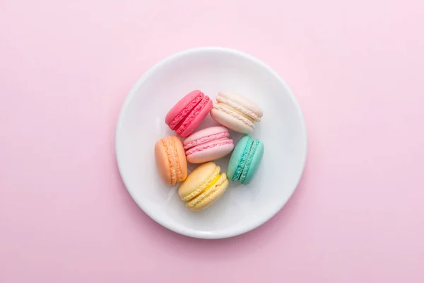 Colorful pastel cake macaron or macaroon on plate. Stock Picture