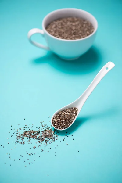 Cup of healthy chia seeds and spoon. Text space. — Stock Photo, Image