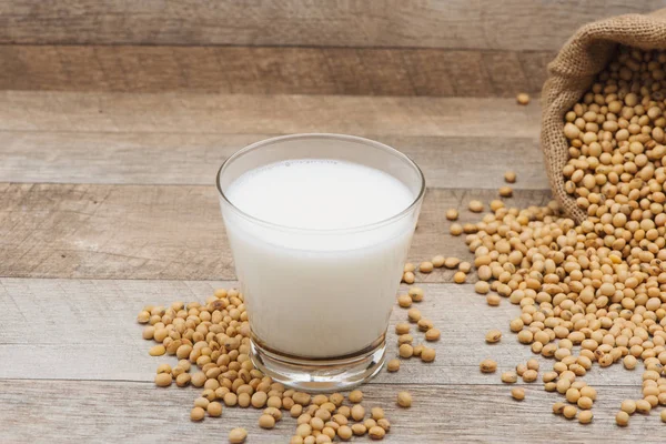 Glass with soy milk and beans — Stock Photo, Image