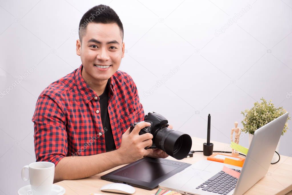 Professional photographer holding camera