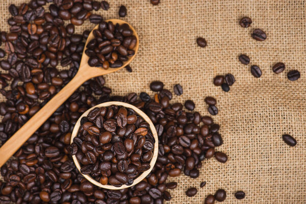 Wooden bowl with coffee beans