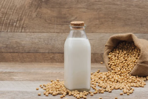 Soy milk and soybeans — Stock Photo, Image