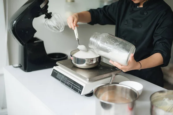 Bakery chef making dough