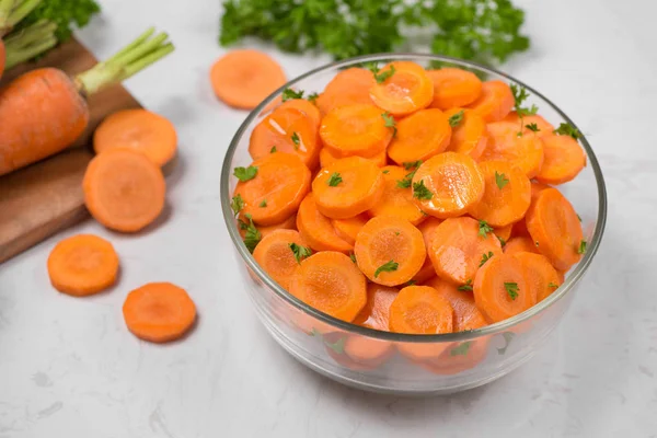 Peeled carrot slices in bowl. — Stock Photo, Image