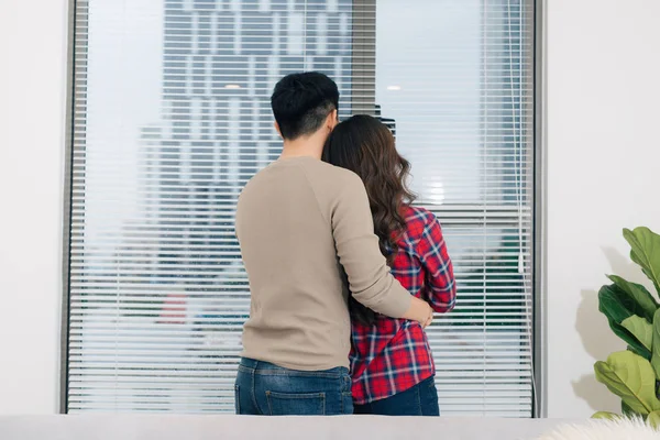 Happy Asian Couple Hugging New Home — Stock Photo, Image