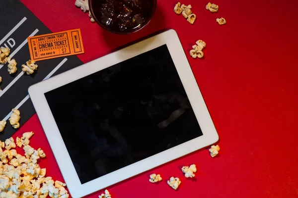 Cinema Concept Digital Tablet Screen Clapperboard Ticket Popcorn Red Background — Stock Photo, Image