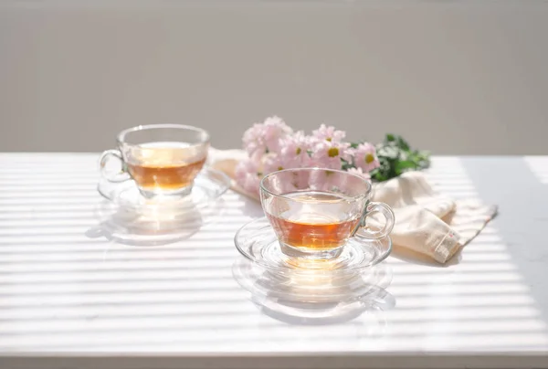 Cups of tea on the windowsill. Tea time.
