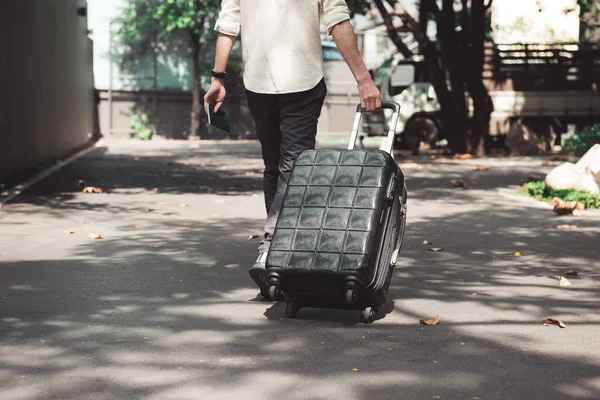 stock image Young man and traveling luggage suitcase walking