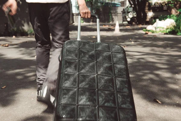 Young man and traveling luggage suitcase walking