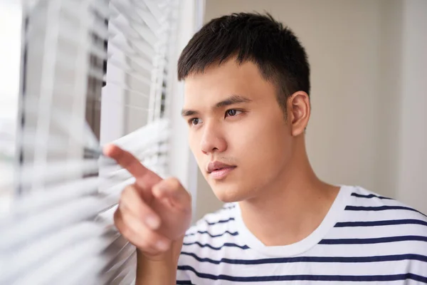 Asian Man Looking Blinds Bright Room — Stock Photo, Image