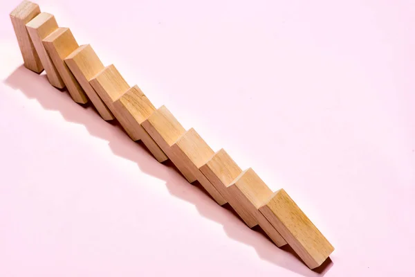 Domino Block Dominoes Continuous Toppled Pink Background — Stock Photo, Image
