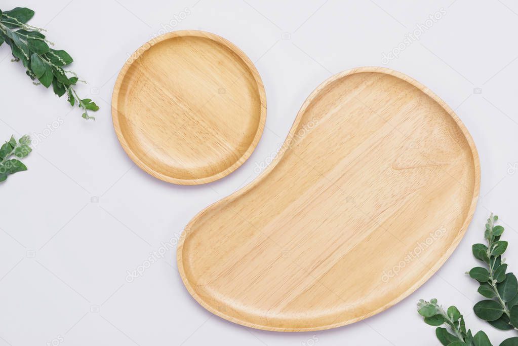 Set of wooden plates on the white background