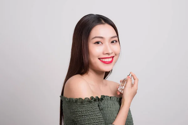 Young Beautiful Woman Holding Bottle Perfume Smelling Aroma — Stock Photo, Image