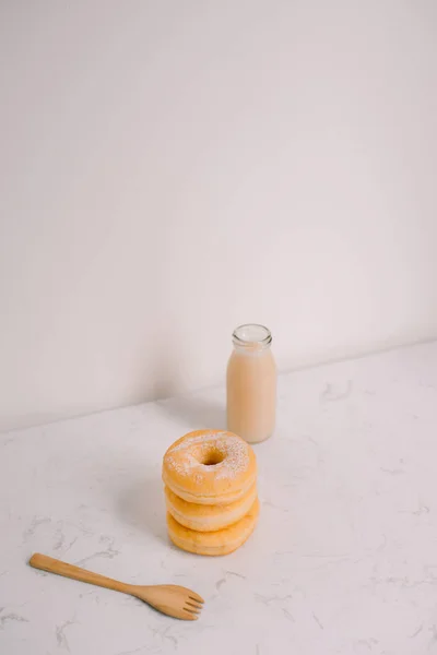 Bottle of milk and donuts, selective focus