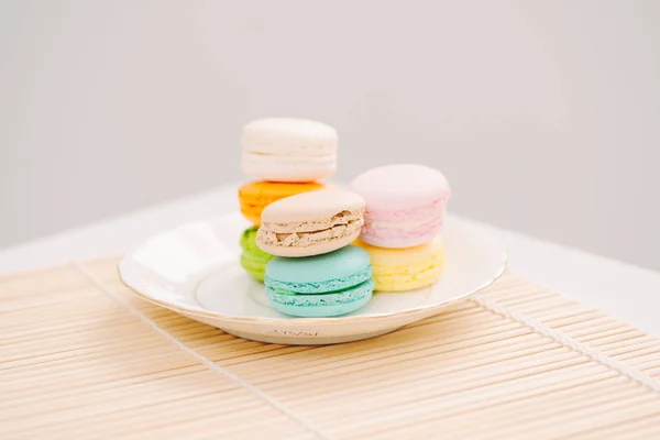 Delicious french dessert. Colorful pastel macaroons on plate