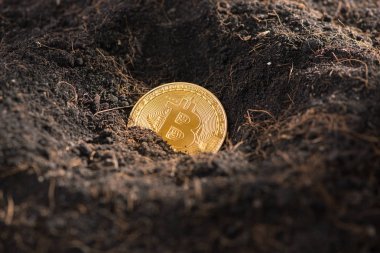 Altın Bitcoin madencilik, yere sikke
