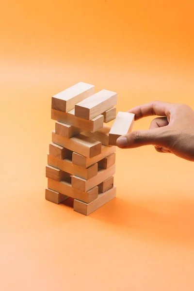 Businessman Gambling Placing Wooden Block Tower — Stock Photo, Image