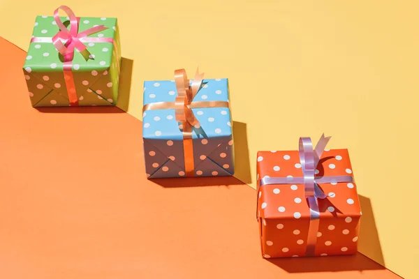 Christmas gifts paper decorated with ribbon on light color paper