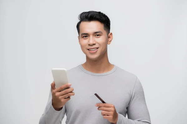 Charming Young Asian Man Having Fun Paying His Online Shopping — Stock Photo, Image