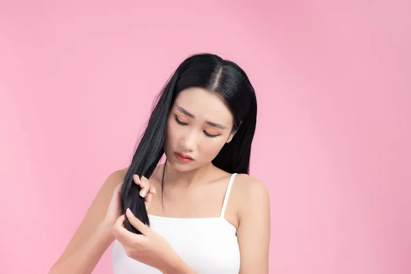 Young Asian Woman Worried Her Hair Isolated Pink Background — ストック写真