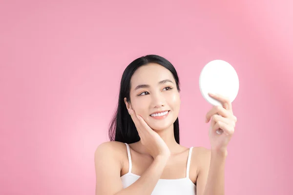 Young Beautiful Asian Woman Looking Mirror Pink Background — стокове фото