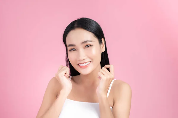 Excited beautiful young woman posing with perfect skin over pink — 图库照片