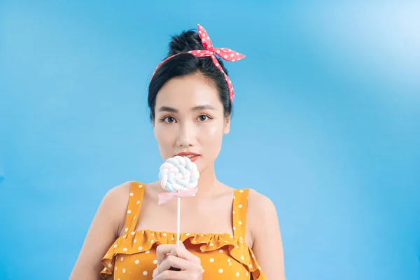 Attractive Young Woman Yellow Dress White Dots Holding Bright Lollipop — 스톡 사진