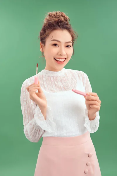 Cheerful Young Asian Woman Applying Lipstick Isolated Green Background — 스톡 사진