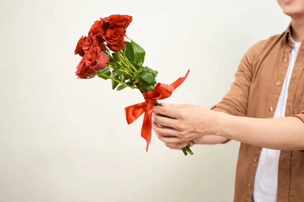 Happy Handsome Young Man Holding Bunch Flowers — Stock Photo, Image