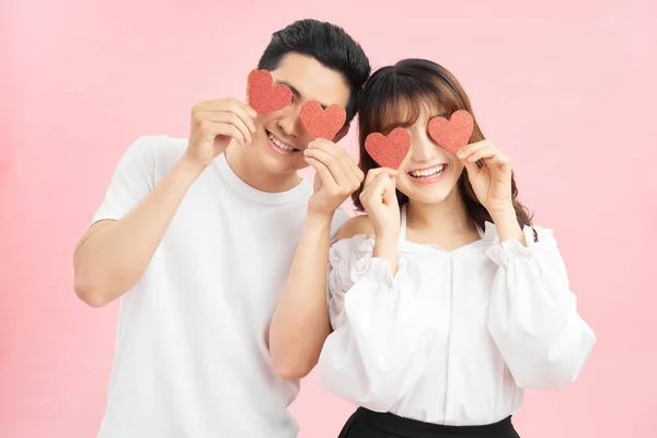 Attractive Young Couple Holding Red Love Hearts Eyes Isolated Pink — Stock Photo, Image