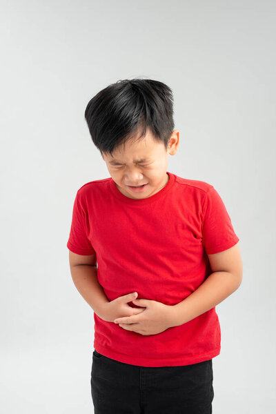 Asian boy with problems stomach ache isolated on white background