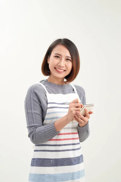 Happy Attractive Asian Female Waiter Apron Writing Order Looking Camera — Stock Photo, Image