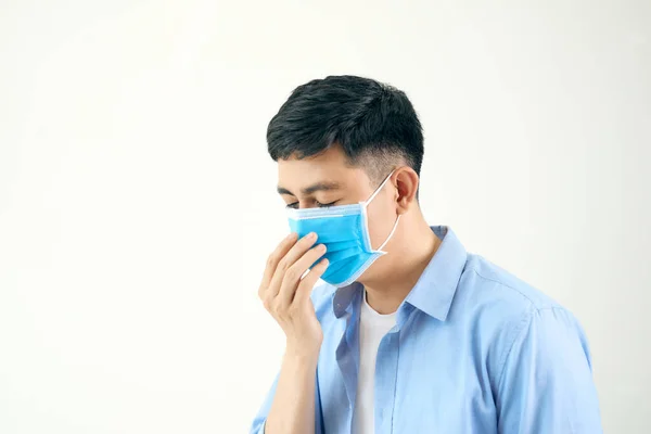 Asian man wearing a face mask with coughing