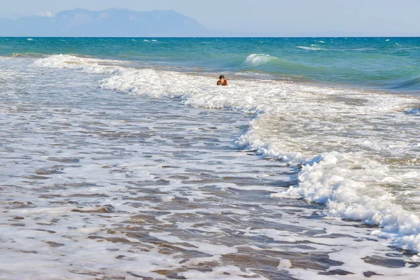 The boy in the sea wave surf. — Stock Photo, Image