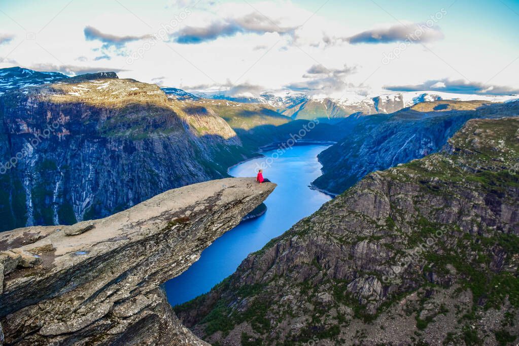 The tourist on the Trolltunga, Norway.