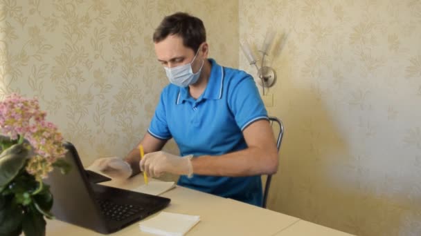 Young Man Protective Mask Gloves Works Computer Using Protective Equipment — Stock Video