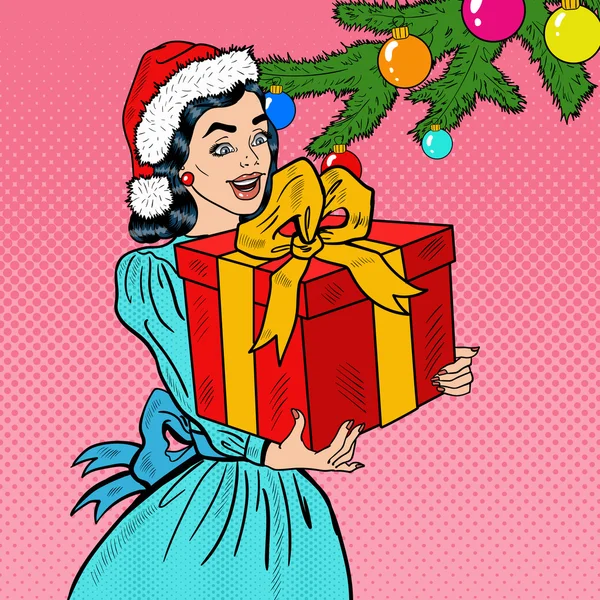 Pop Art Jovem feliz mulher segurando caixa de presente de Natal. Ilustração vetorial —  Vetores de Stock