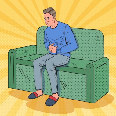 Pop Art Unhappy Man Suffering from Stomach Ache. Sick Guy Sitting on Couch at Home. Vector illustration clipart