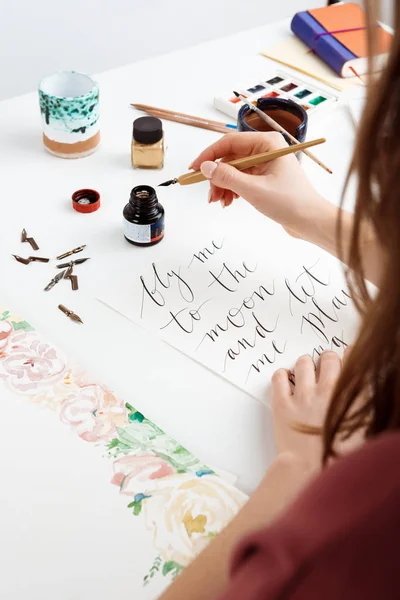 Girl writing calligraphy on postcards. Art design.