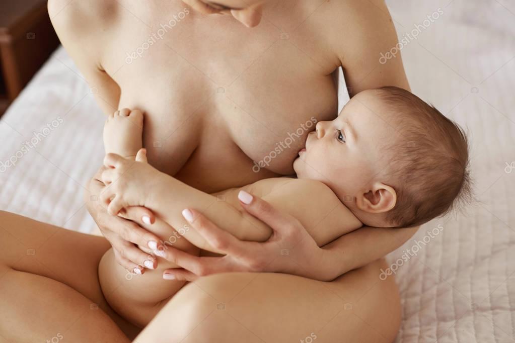 Young Beautiful Naked Mom Breastfeeding Hugging Her -9883