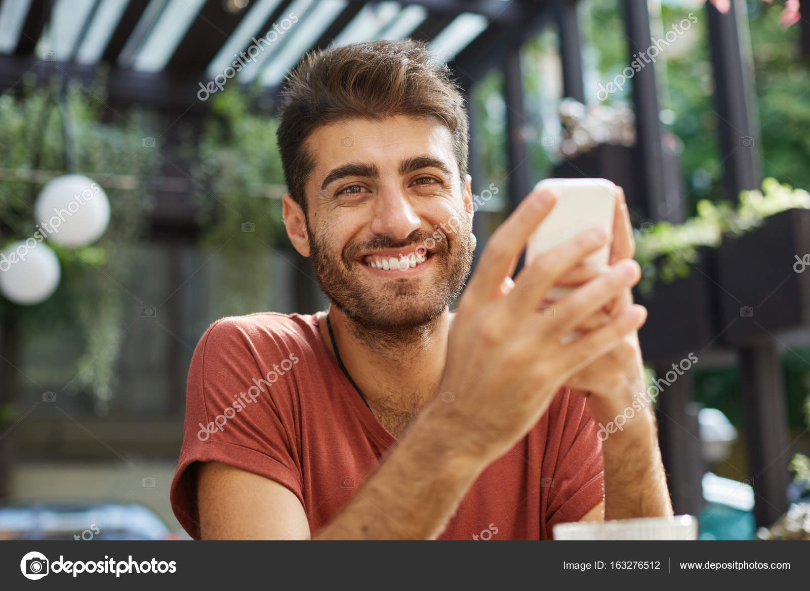 Outdoor Shot Of Attractive Man With Smile And Trendy