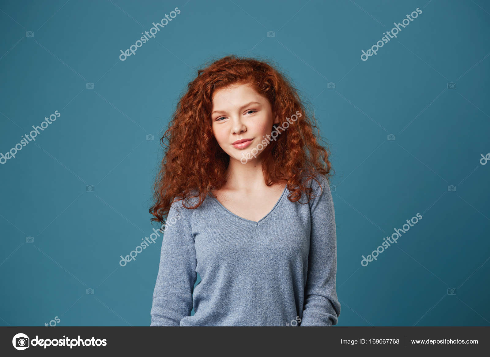 Portrait Of Good Looking Student Girl With Ginger Curly Hair And
