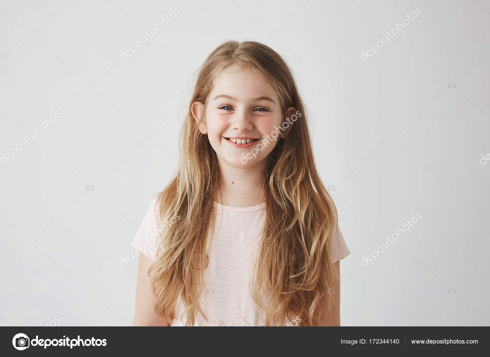Close Up Of Funny Little Girl With Blue Eyes And Blonde Hair