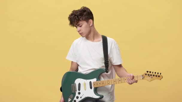 Portrait Of Teenage Boy With Short Curly Hair Posing With Electric