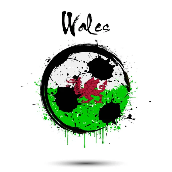 Pallone da calcio nei colori della bandiera gallese — Vettoriale Stock
