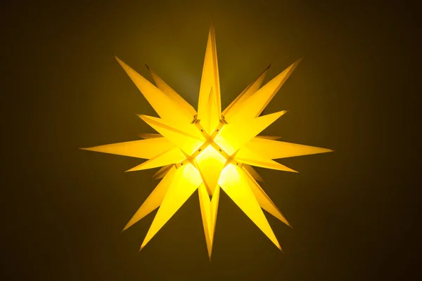 Yellow illuminated moravian star — Stock Photo, Image