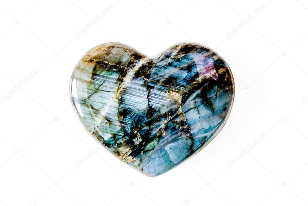 Heart made of precious stone in front of white background 