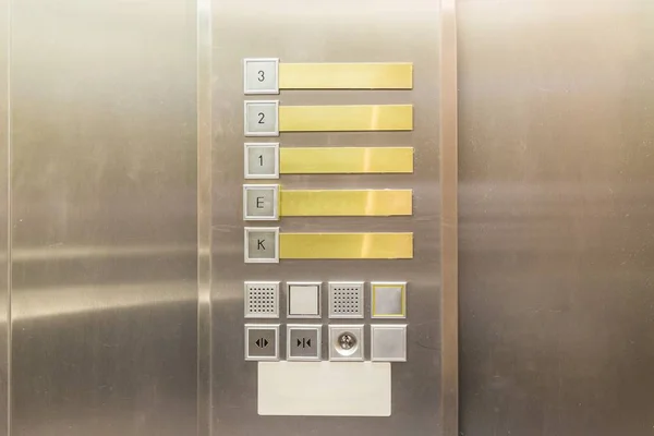 Inside of an elevator car with control buttons