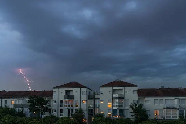 Dark clouds with flash of lightning above Regensburg, Germany
